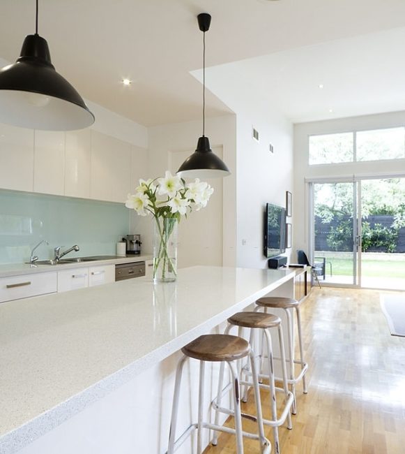 Contemporary kitchen and open plan living room with garden aspect Contemporary kitchen and open plan living room with garden aspect